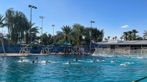 A swimming pool with lane dividers and a diving platform. - Bright and Cheerful South Desert Home (Palm Desert)