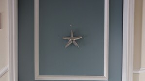 A door with a star decoration and a welcome mat. - Beach Views and Cozy (Corpus Christi)