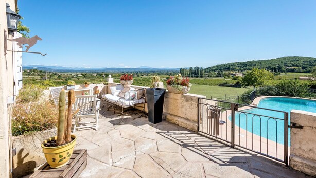 A patio with a pool, outdoor furniture, and a cactus plant. - PROVENCE MAS IN A THOUSAND VINEYARDS VIEW ON MONT VENTOUX WITH POOL (Saint-Montan)