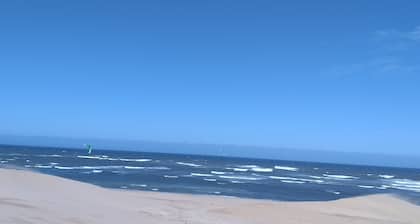 Beach house on golden sand dunes