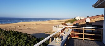 Beach house on golden sand dunes