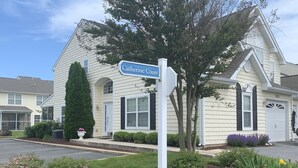 A residential building with a sign reading "Catherine Court." - Convenient location in Rehoboth beach. Two master suites, pool - 4BR-3.5BA (Rehoboth Beach)