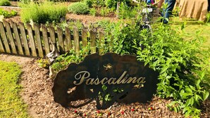 A garden with a sign reading "Pascalina." - We welcome Short & Long Term Guest .  (Aiken)