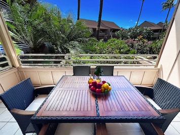 Relax and take in stunning views from this spacious lanai, perfect for outdoor lounging.