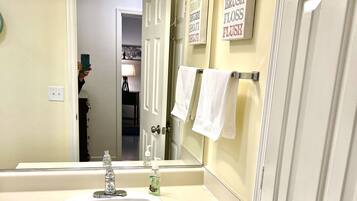 Combined shower/tub, hair dryer, towels, soap