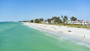On the beach, sun loungers, beach towels