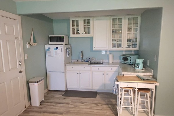 Beautiful Kitchen with Toaster Oven, Microwave, Full refrigerator