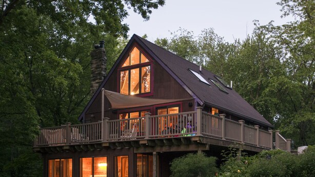 A wooden cabin with a balcony, large windows, and a chimney. - Lake MacBride Cabin & State Park! Near Amana Colonies, Iowa City & Cedar Rapids (Solon)