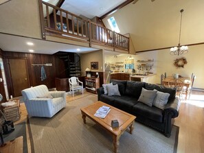 The main living area showing living room, dining area and kitchen.