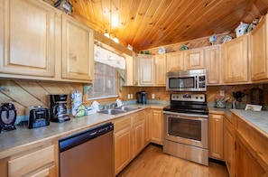 Enjoy cooking in this well-equipped kitchen with a dishwasher, coffee maker, toaster, and microwave.