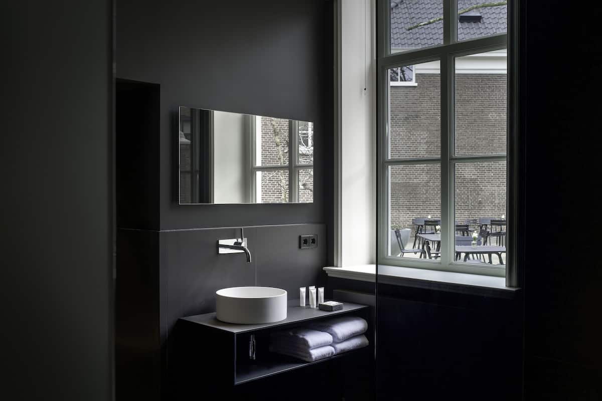 designer toiletries, hair dryer, bathrobes, towels