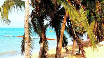 On the beach, sun-loungers