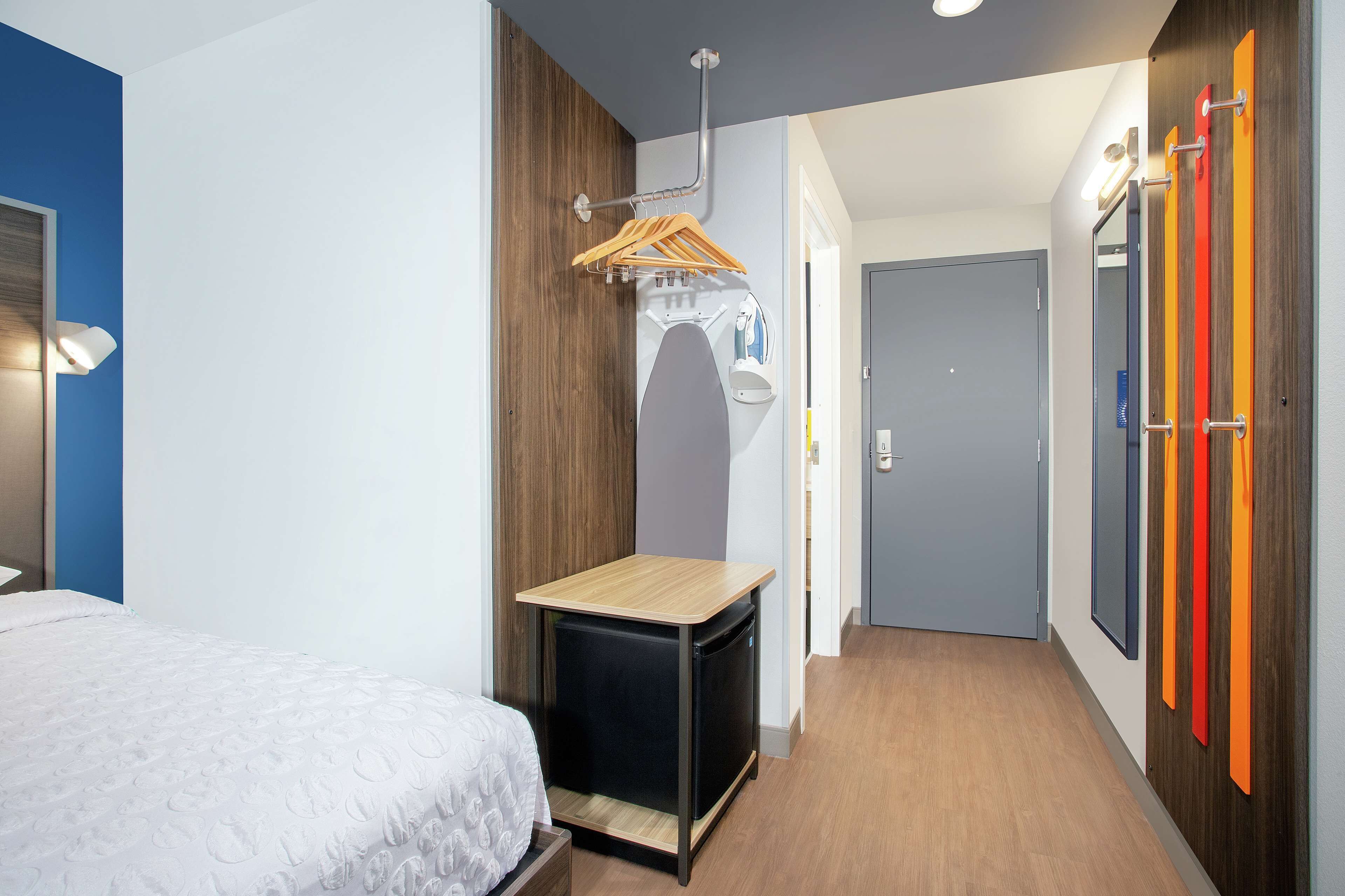 desk, laptop workspace, blackout curtains, iron/ironing board