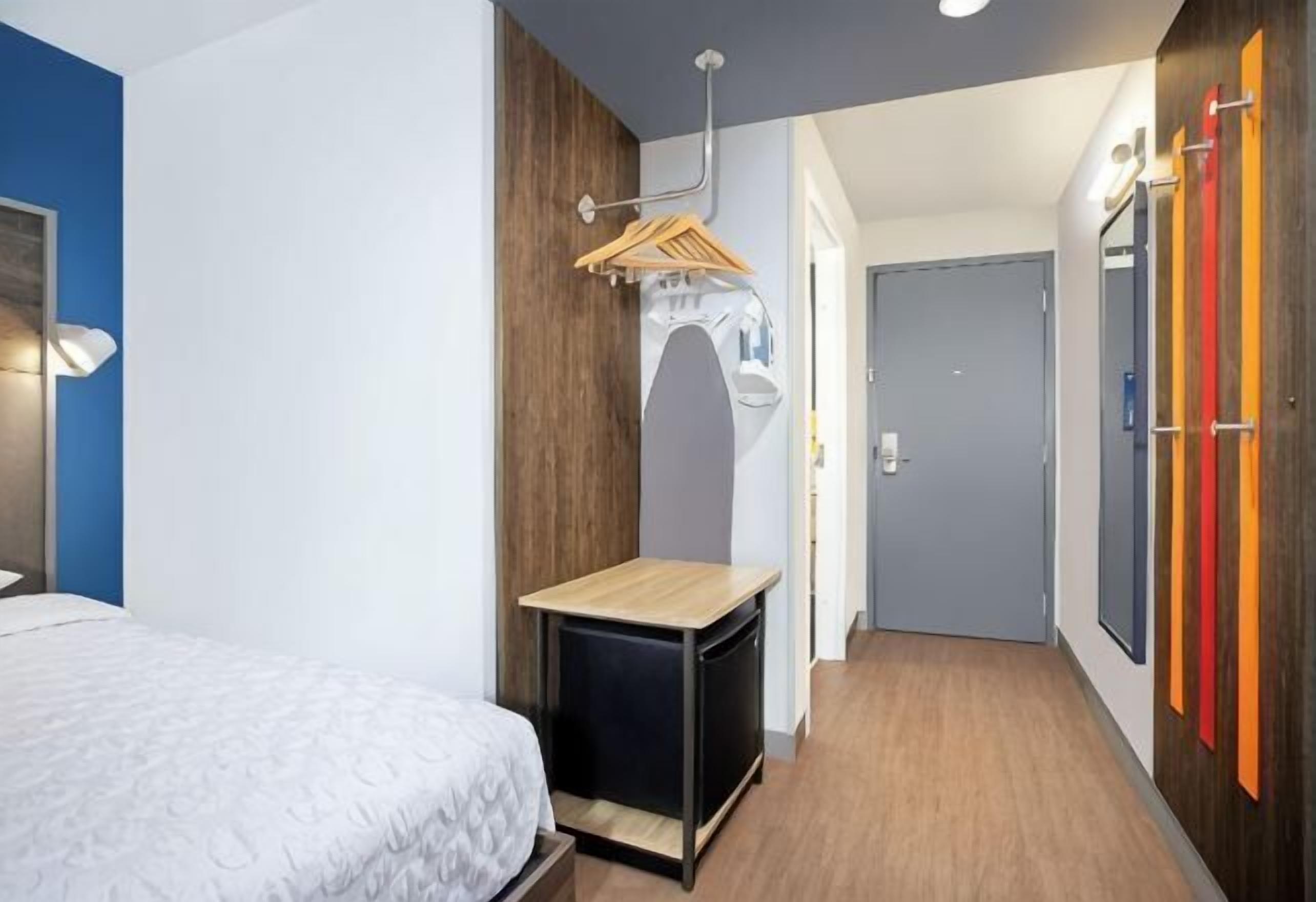 Desk, laptop workspace, blackout drapes, iron/ironing board