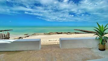 On the beach, sun-loungers, beach towels