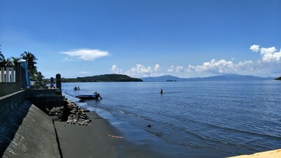 Relaxing beach side condo with mountain and island views.