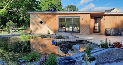 Charming Welsh Farmhouse, natural swimming pool, fabulous views, sleeps to 14