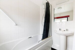 Combined shower/tub, hair dryer, towels, soap