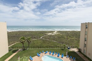 Relax by the pool surrounded by ocean views.