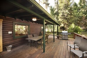 Enjoy al fresco dining on the covered deck, complete with a grill for outdoor cooking.