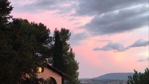 A rustic house with a tiled roof, surrounded by trees and a grassy yard. - Seventeenth-century Villa Giulia with panoramic swimming pool, +15 beds ((PERUGIA))