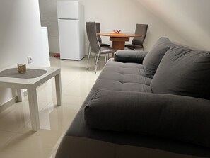 Deluxe Studio | Living area | TV