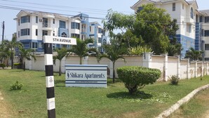 A sign for Shikara Apartments with a clear view of the building's exterior, including balconies and windows. - Shikara Apartment (Mombasa)