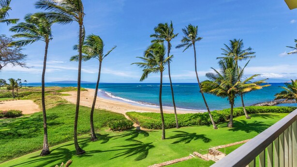 A tropical beach view with palm trees, a golf course, and the ocean. - Stunning Oceanfront, 2BR/2BA, Gorgeous Ocean & Mt. Views, Premium A/C (Kihei)