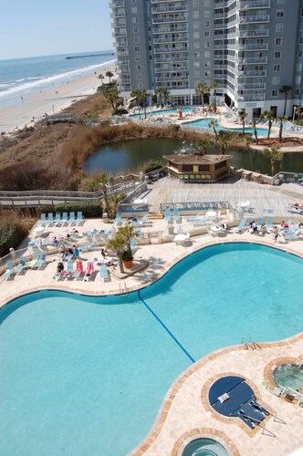 Oceanfront Corner Unit with Wraparound deck. It's practically on the beach!