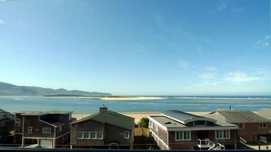A coastal residential area with houses overlooking the beach and ocean. - AMAZING OCEAN VIEW LUXURY Beach Home           !The Skyscraper!  Netarts (Netarts)