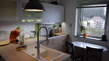 Deluxe Apartment | Private kitchen | Fridge, coffee/tea maker, electric kettle, high chair