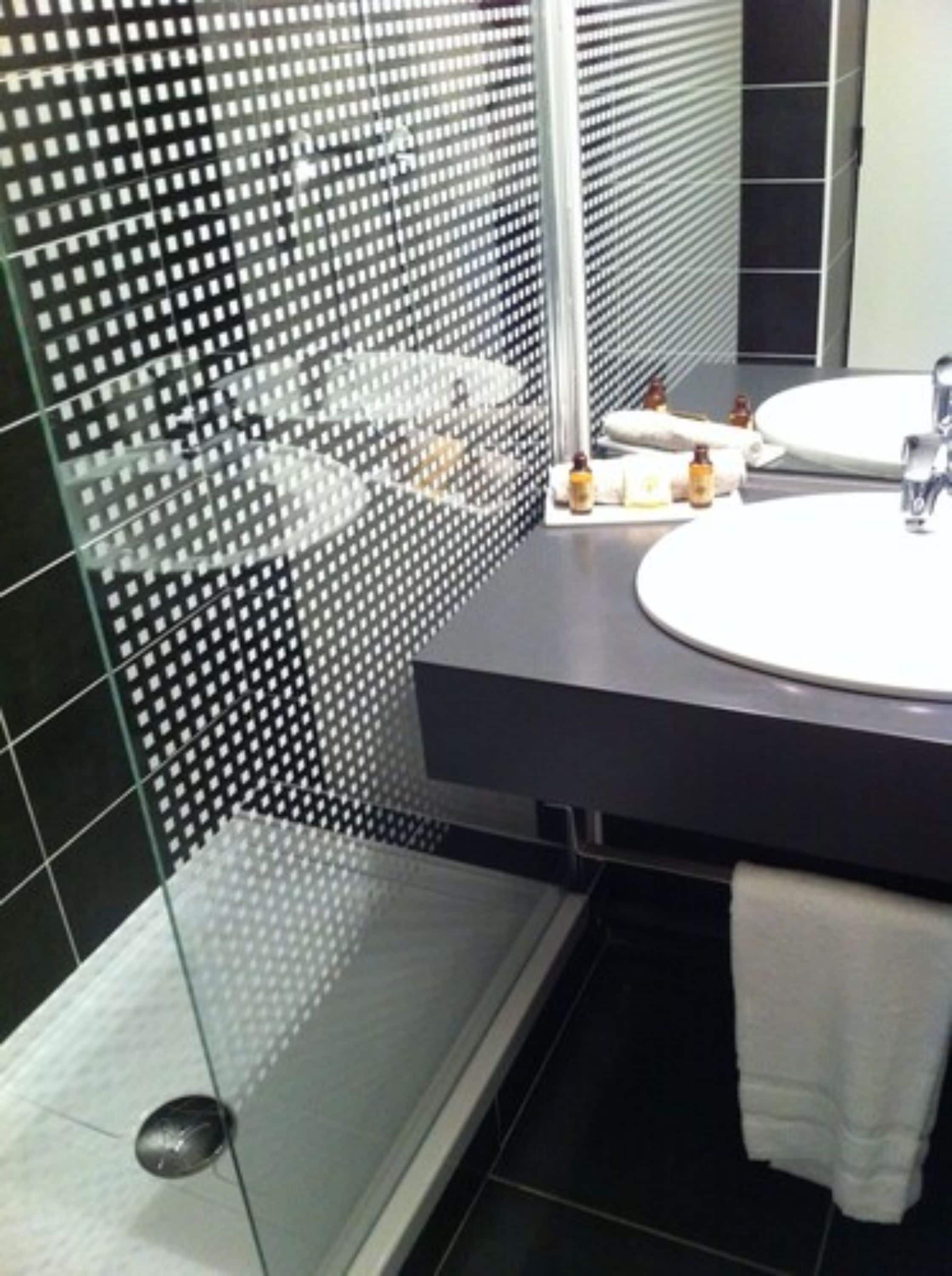 superior double room | bathroom | free toiletries, hair dryer, towels