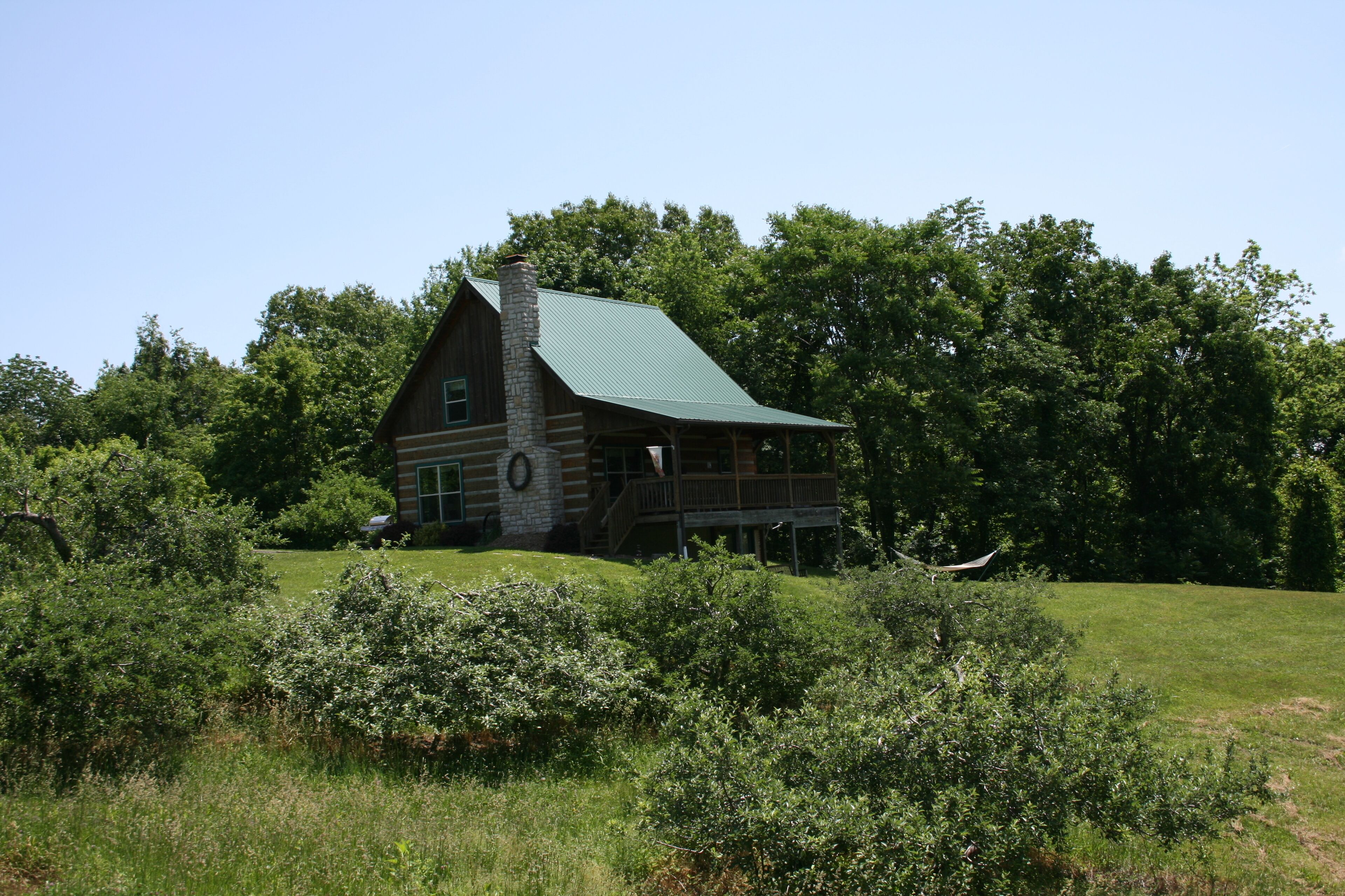 Rest & relax in a fully furnished cabin on a working orchard and vineyard.