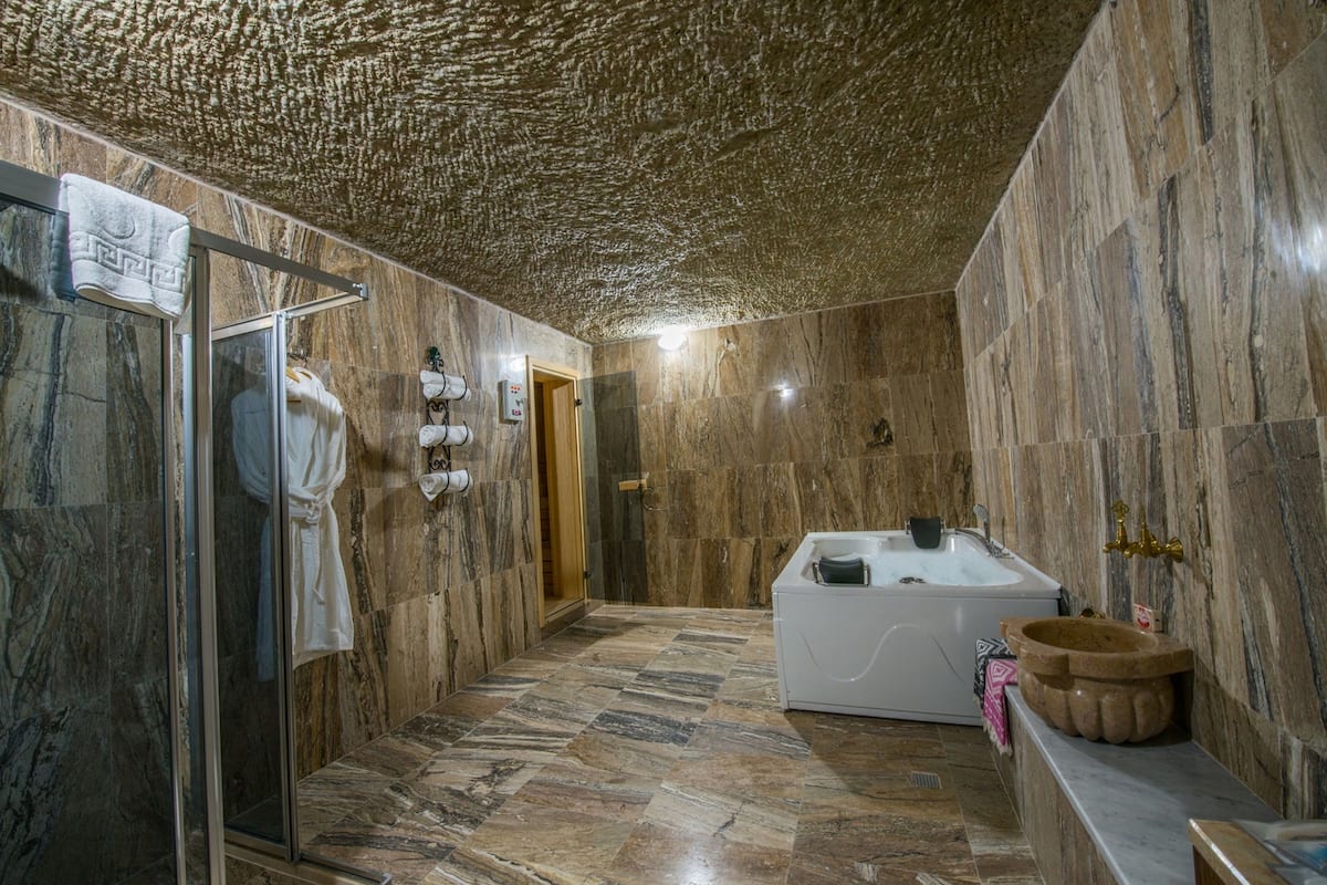 family suite, multiple beds, non smoking, garden view | bathroom | shower, free toiletries, hair dryer, slippers