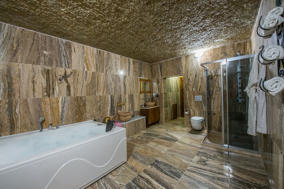 family suite, multiple beds, non smoking, garden view | bathroom | shower, free toiletries, hair dryer, slippers