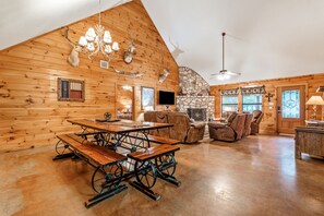 Cozy up by the stone fireplace in this inviting lodge with a large dining area and comfortable seating.