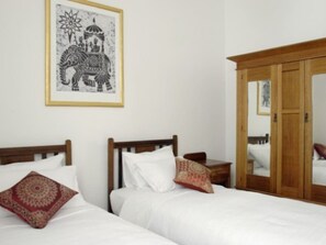 2 bedrooms, blackout drapes, iron/ironing board, travel crib