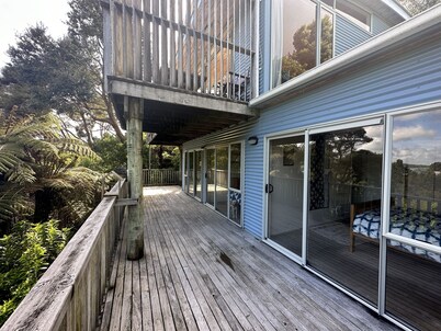 Sunny with decks and bush/harbour views. Three bedrooms. Pet friendly.