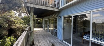 Sunny with decks and bush/harbour views. Three bedrooms. Pet friendly.