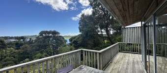 Sunny with decks and bush/harbour views. Three bedrooms. Pet friendly.