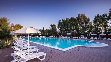 Seasonal outdoor pool, pool umbrellas, pool loungers