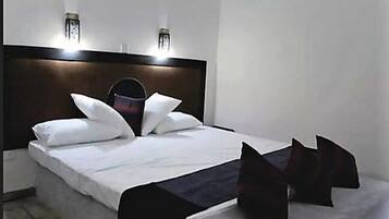 Cortinas blackout y tabla de planchar con plancha