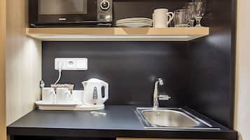 Mini-fridge, microwave, electric kettle, cookware/dishes/utensils