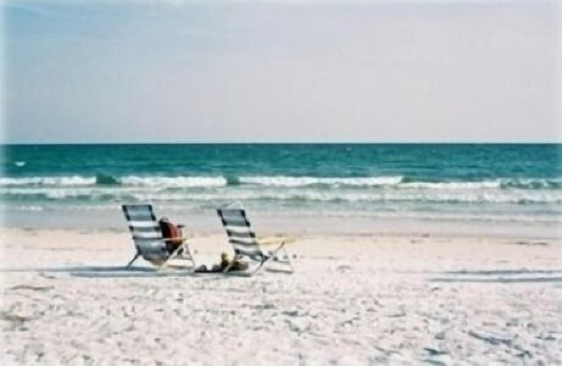On the beach, sun-loungers, beach towels