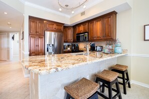 Fridge, microwave, oven, stovetop - Gulf Front Condo | Outdoor & Indoor Pools! (Orange Beach)