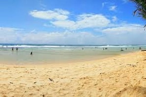 A beach with clear skies and calm waters.