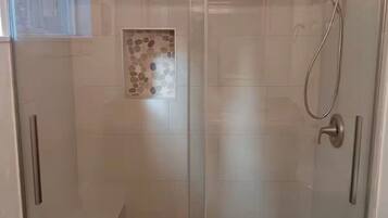 Combined shower/tub, hair dryer, towels, soap