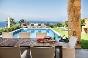 Outdoor dining - Villa Emilia front sea amazing sunset , large swimming pool  can be heated . (Kalathas)