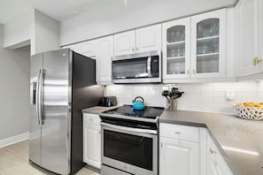 Coffee/tea maker, fridge, microwave, oven