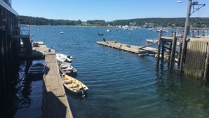 A marina with boats docked, a wooden pier, and a clear blue sky. - Weekly Discount available! 4 Bedroom, 2 Bathroom, Walking Distance To Town (Southwest Harbor)